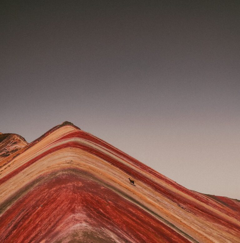 Colorful mineral layers on Rainbow Mountain Vinicunca in the Andes of Peru (rainbow mountain full day) | Viajes Peru Tour